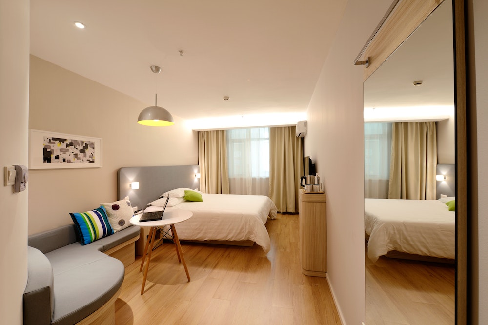 Wide angle photo of a hotel room